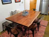 View of live edge dining table and chairs